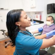 Whitney Walker, RN, caring for a participant in an Alzheimer's disease trial Whitney Walker, RN, caring for a participant in an Alzheimer's disease trial